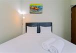 Location vacances Bogor - Homey and Minimalist 1br Royal Sentul Park Apartment By Travelio-1