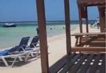 Location vacances  Jamaïque - Mirando Place---Beach Access, ,Pool, Hottub, Gym,3 Lounges, Townhouse #1-Airport 10 mins-2