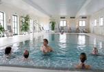 Location vacances Bayerbach - Ebenerdiges Chalet im Vital Camp Bayerbach-4
