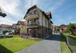 Location vacances Canal Elblag - Apartment with a balcony, garden with barbecue-1