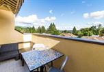 Location vacances  Monte San Giorgio - Lovely Orange House-3