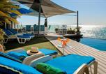 Location vacances Gordon's Bay - 185 on Beach Boutique Suites-4
