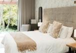 Location vacances  Emerald Backpackers - 55 Tulbagh Boutique Guest House - Or Tambo-1